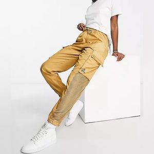 Nike Air Jordan Essentials woven pants in gold Standard fit
